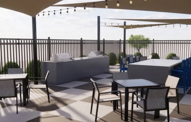 A patio with tables and chairs under a canopy.