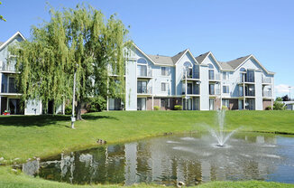 Lake With Lush Natural Surroundings at Huntington Cove Apartments, Merrillville, IN