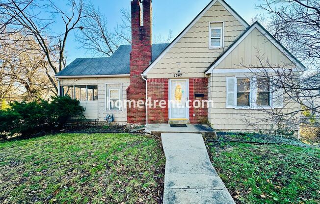 Adorable Home Featuring Wood Floors, SS Appliances, Updated Bathrooms and Plenty of Natural Light!