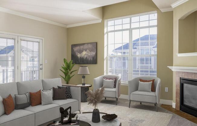 a living room filled with furniture and a large window