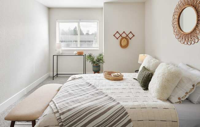 a bedroom with a bed and a window