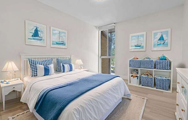 A bedroom with a large bed and a white nightstand.