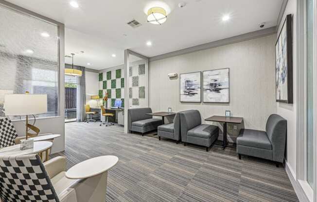 Spacious business center featuring private booths and a contemporary design at Allusion at West University apartments in Houston, TX