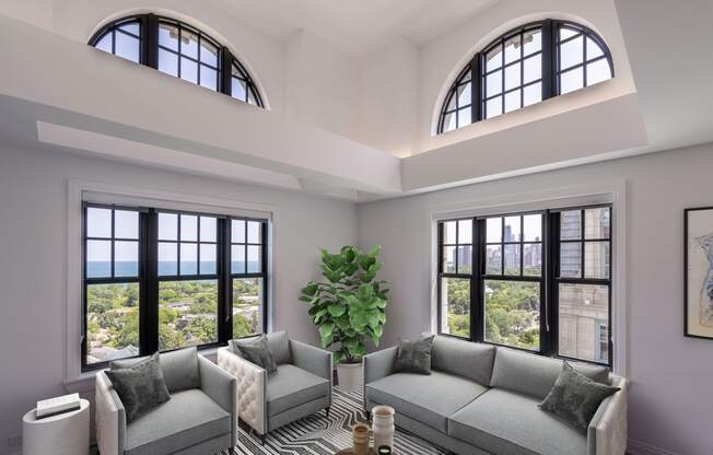 a living room with two couches and two windows  at The Belden Stratford, Chicago, 60614