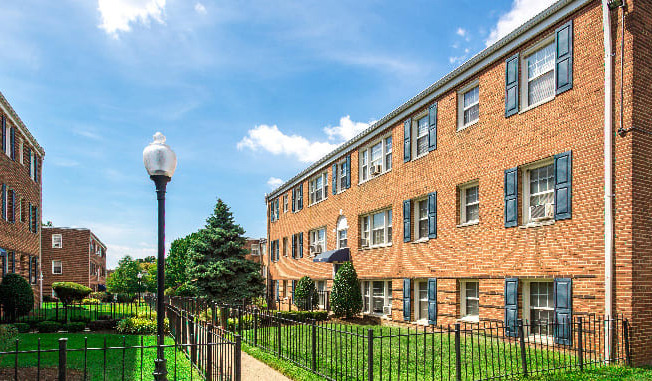 exterior of brick apartment building at jetu apartments in washington dc