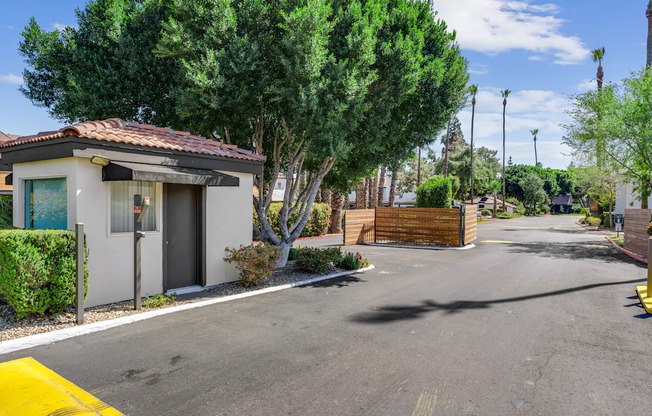 A small house with a driveway in front of it.