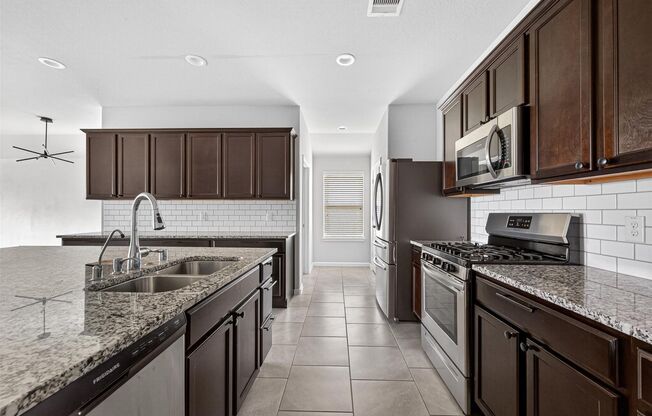 Located in the desirable Tamarron community, this well-maintained single-story home offers 4 bedrooms and 2 bathrooms with a bright, open-concept layout designed for both everyday living and entertaining. The kitchen showcases a large granite island, mode