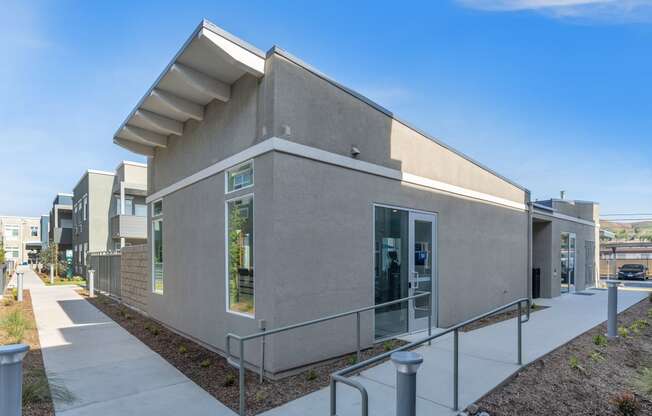 a gray building with a white awning at Loma Villas Apartments, San Bernardino, 92408