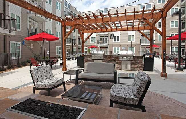 Outdoor Grill With Intimate Seating Area at Link Apartments® Brookstown, North Carolina, 27101
