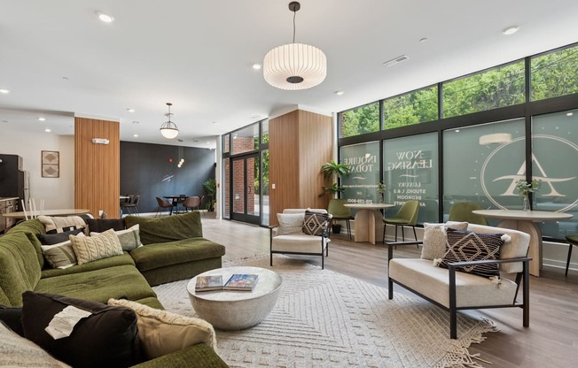 A living room with a green couch and a coffee table.