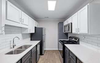 the preserve at ballantyne commons apartment kitchen with stainless steel appliances