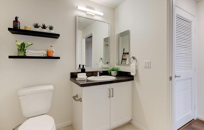 a kitchen with a sink and a mirror