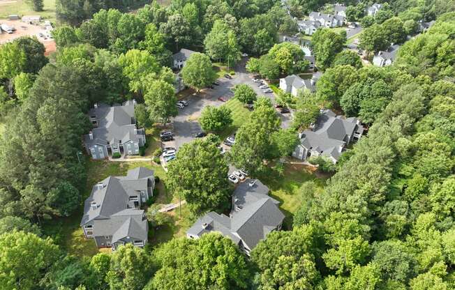 an aerial view of a neighborhood with houses and trees