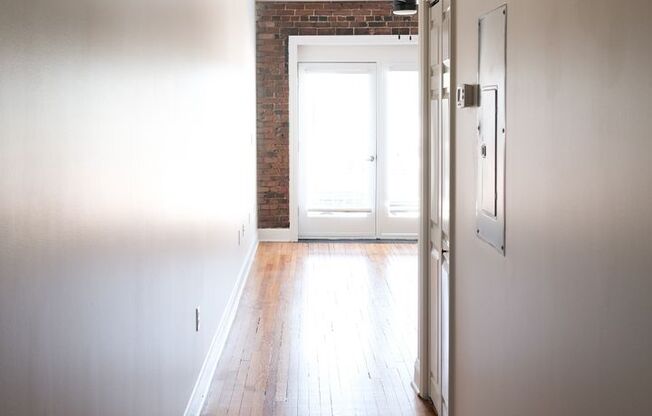 Main Street Apartment with beautiful exposed brick!