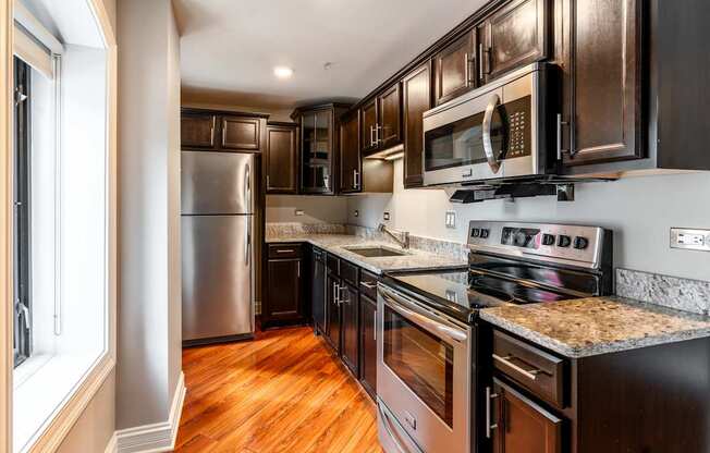a kitchen with stainless steel appliances and granite counter tops