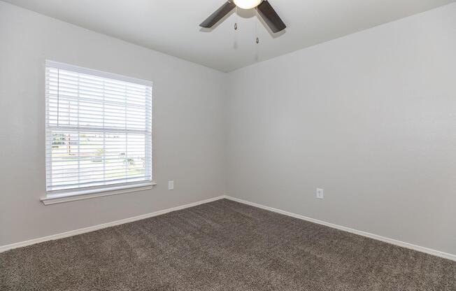 a bedroom with a large window