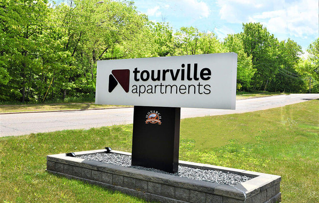 sign located outside tourville apartments