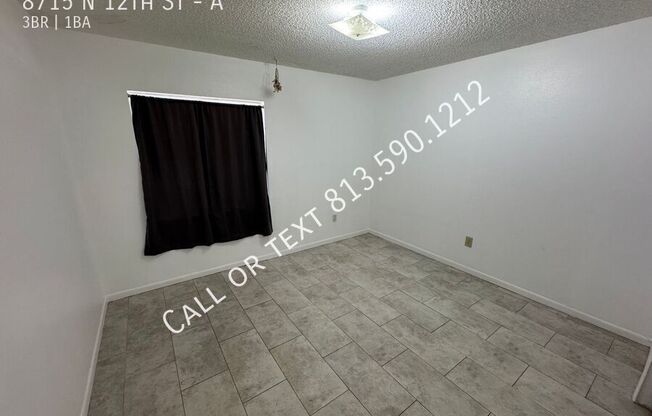 8715 N 12 ST