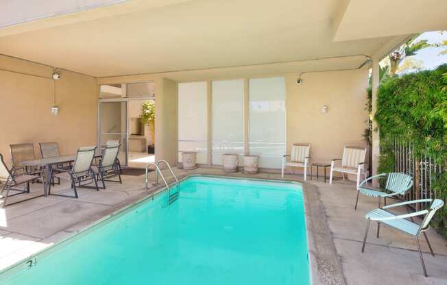 Community swimming pool with chairs