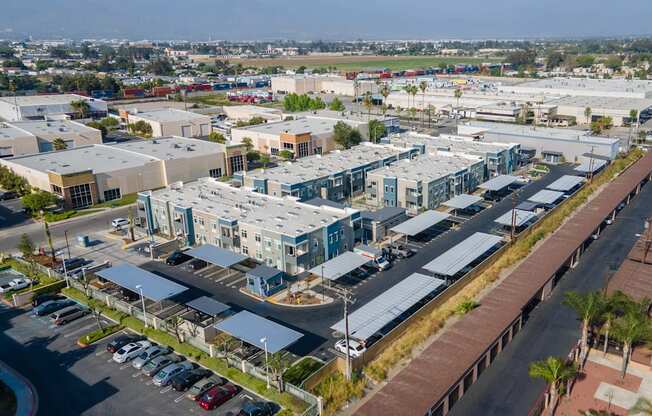 an aerial view of a city with several apartment buildings and a parking lot at Loma Villas Apartments, San Bernardino, 92408