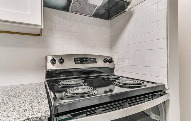 a kitchen with a stove and a counter top