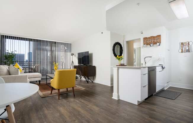 kitchen island and livingroom with seating and large windows at Vera Cortez Hill, California, 92101