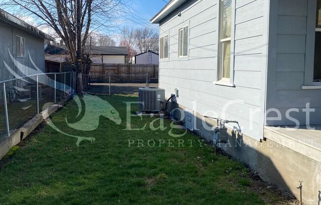 Charming 2 Bedroom Home With 1 Car Garage and A Covered Porch