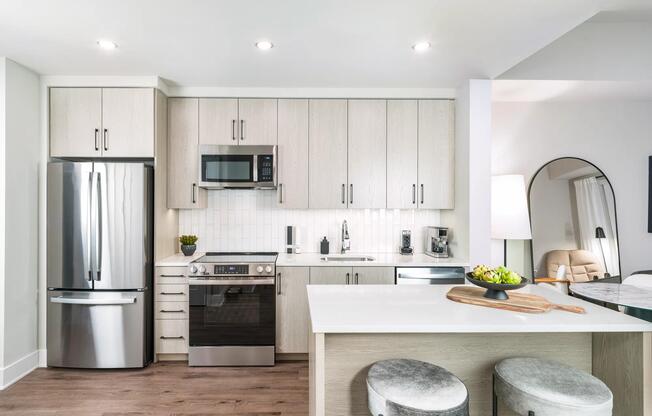 Sleek, modern, and made for entertaining—your Modera H Street kitchen features quartz countertops, stainless steel appliances, and style that serves every occasion.