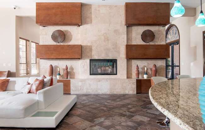 A living room with a fireplace and a couch.