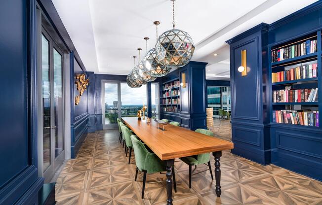 Gather in the library lounge at Modera Old Ivy, where rich design and skyline views set the scene.