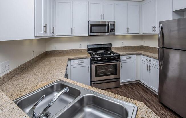 a modern kitchen with stainless steel appliances