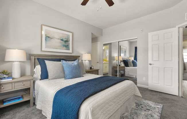 a bedroom with a bed and a ceiling fan at Vaseo Apartments, Phoenix, AZ 85022