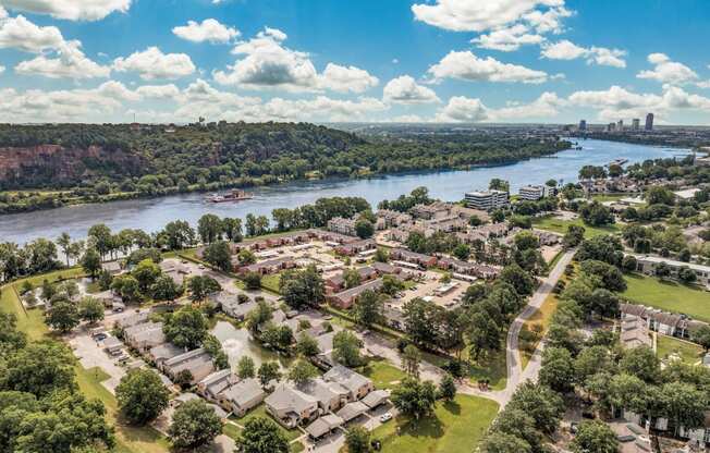 an aerial view of a city with a river and trees at Brightwaters Apartments, Little Rock, Arkansas