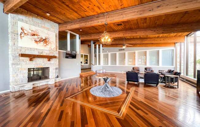 A living room with a fireplace and a painting on the wall.