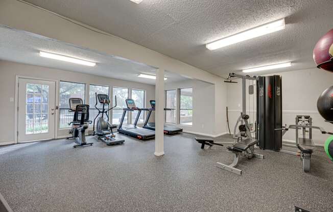 the gym at the enclave at woodbridge apartments in sugar land tx