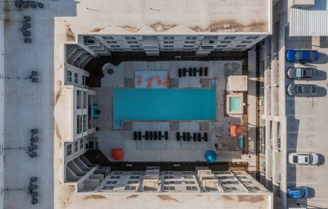 an aerial view of a building with a blue pool at Residences at 3000 Bardin Road, Grand Prairie, TX, Texas