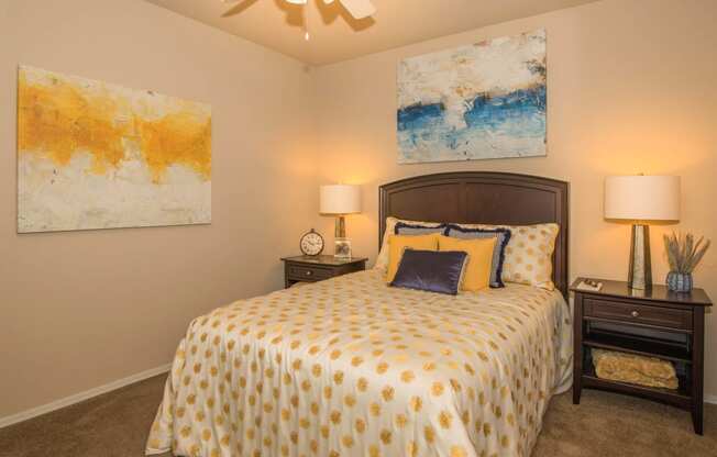 Bedroom with yellow light and frame at The Aliante by Picerne, Arizona