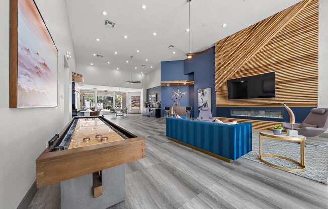a game room with a pool table and a tv