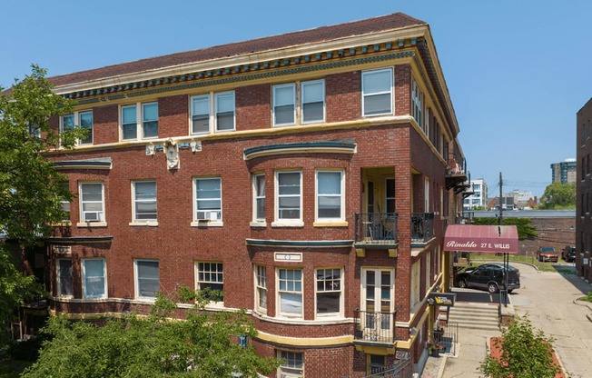 a red brick building on the corner of a street