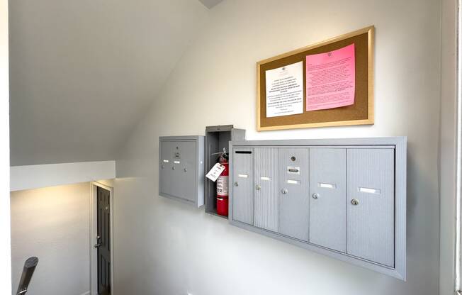 a view of the lockers and a fire extinguisher on the wall of a