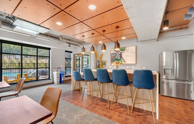 the yards and backyards commons community room with bar stools
