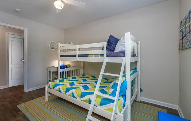White bunk bed in a bedroom at Ashley Oaks Apartments in Greensboro, North Carolina