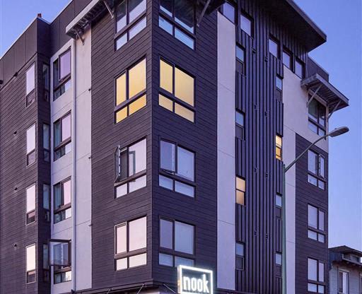 a tall building with a motorcycle parked in front of it