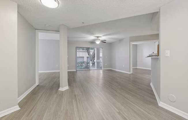 the living room and dining room of an empty apartment at Pembroke Pines Landings, Pembroke Pines, Florida, 33025