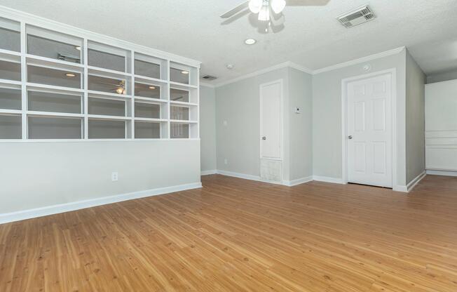 a large empty room with a wood floor