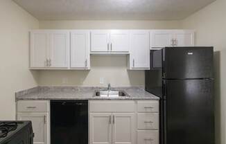 This is a photo of the kitchen in the 543 square foot A-style, 1 bedroom, 1 bath apartment at Blue Grass Manor Apartments in Erlanger, KY.