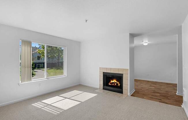 a living room with a fireplace and a window