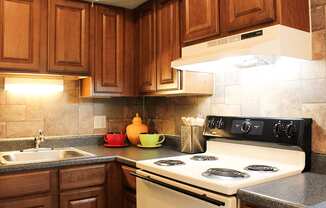 a kitchen with a stove and a sink