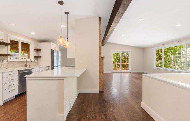 Completely Remodeled Kenmore Home with Two-Car attached Garage and Fenced Backyard!