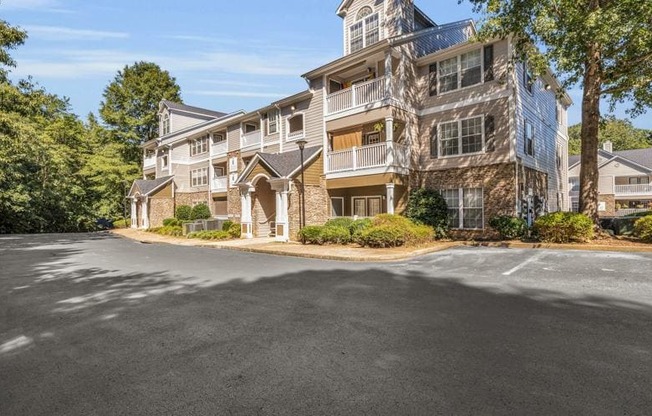 an empty parking lot in front of an apartment building at Marina Point, Chattanooga, TN 37415